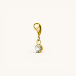 Nadare Co. Aura threadless gold earring front with a sculptural organic shape and a bezel-set cubic zirconia drop.