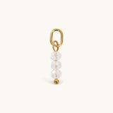 Nadare Co. birth month bead charm featuring three clear faceted beads and a gold jump ring for necklace stacking.