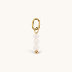Nadare Co. Birth Month Bead Charm featuring three pale pink faceted beads and a gold jump ring for necklace stacking.