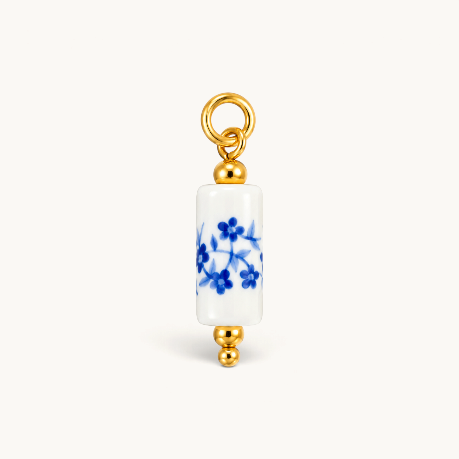 Nadare Co. blue floral porcelain tube bead charm with 14k gold plated stainless steel accents.