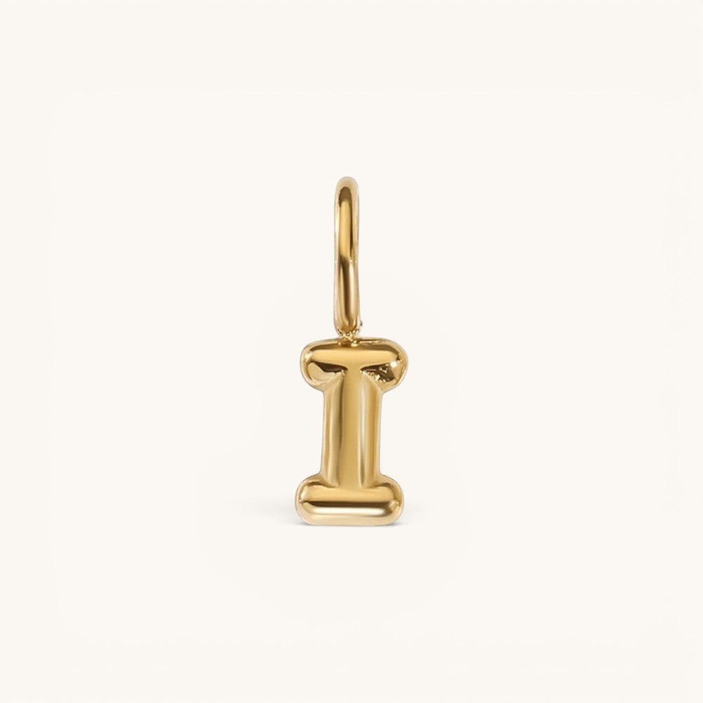 Nadare Co. gold-plated stainless steel bubble initial charm in the shape of the letter I with a rounded puffed design.
