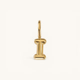 Nadare Co. gold-plated stainless steel bubble initial charm in the shape of the letter I with a rounded puffed design.
