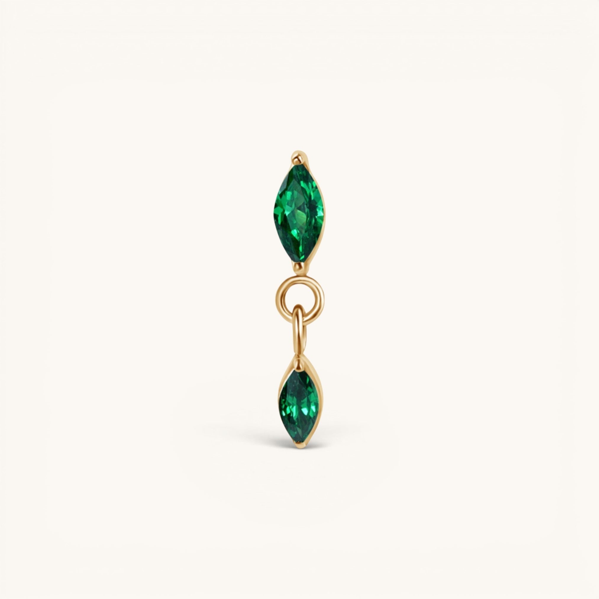 Nadare Co. Camille threadless earring front with two marquise-cut green cubic zirconia stones in gold setting.