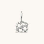 Nadare Co. silver-toned Cancer zodiac charm featuring cubic zirconia accents for a delicate, layered necklace look.