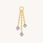 Nadare Co. gold Cascade ear charm featuring three staggered chains with sparkling crystal accents