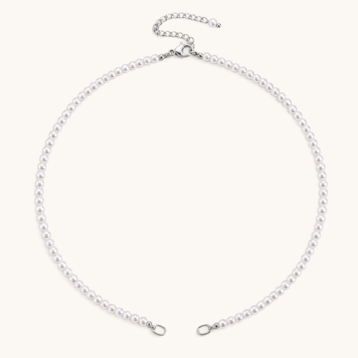 Nadare Co. Classic Pearl Chain featuring round white imitation pearls with a silver-tone clasp and adjustable chain.
