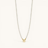 Nadare Co. Classic Pearl Chain featuring round white imitation pearls and a gold-tone circular clasp.