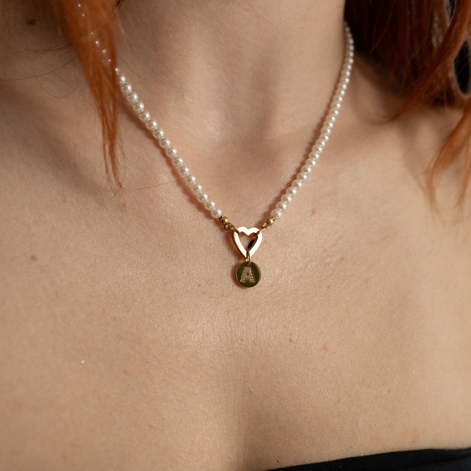 Nadare Co. Classic Pearl Chain featuring round imitation pearls with a gold heart charm and initial pendant