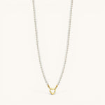Nadare Co. Classic Pearl Chain featuring round imitation pearls and a gold heart-shaped charm clasp