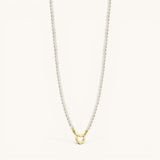 Nadare Co. Classic Pearl Chain featuring round imitation pearls and a gold heart-shaped charm clasp