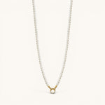 Nadare Co. Classic Pearl Chain necklace with round white imitation pearls and a gold charm clasp.