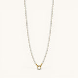 Nadare Co. Classic Pearl Chain necklace with round white imitation pearls and a gold charm clasp.