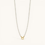 Nadare Co. Classic Pearl Chain featuring round white imitation pearls with a gold-tone clasp for charms.