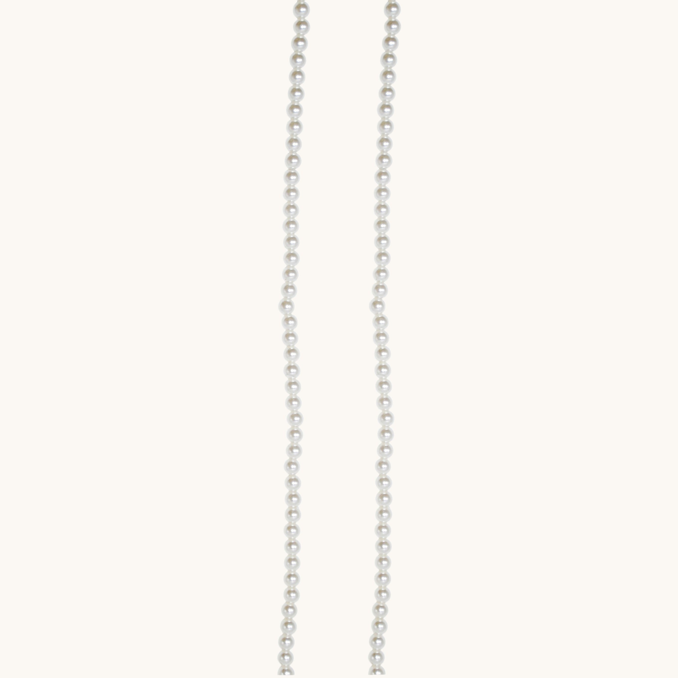Nadare Co. Classic Pearl Chain featuring a delicate strand of uniform white imitation pearls for a timeless look.