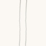 Nadare Co. Classic Pearl Chain featuring a strand of round white imitation pearls for a timeless, elegant look.