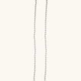 Nadare Co. Classic Pearl Chain featuring a strand of round white imitation pearls for a timeless, elegant look.