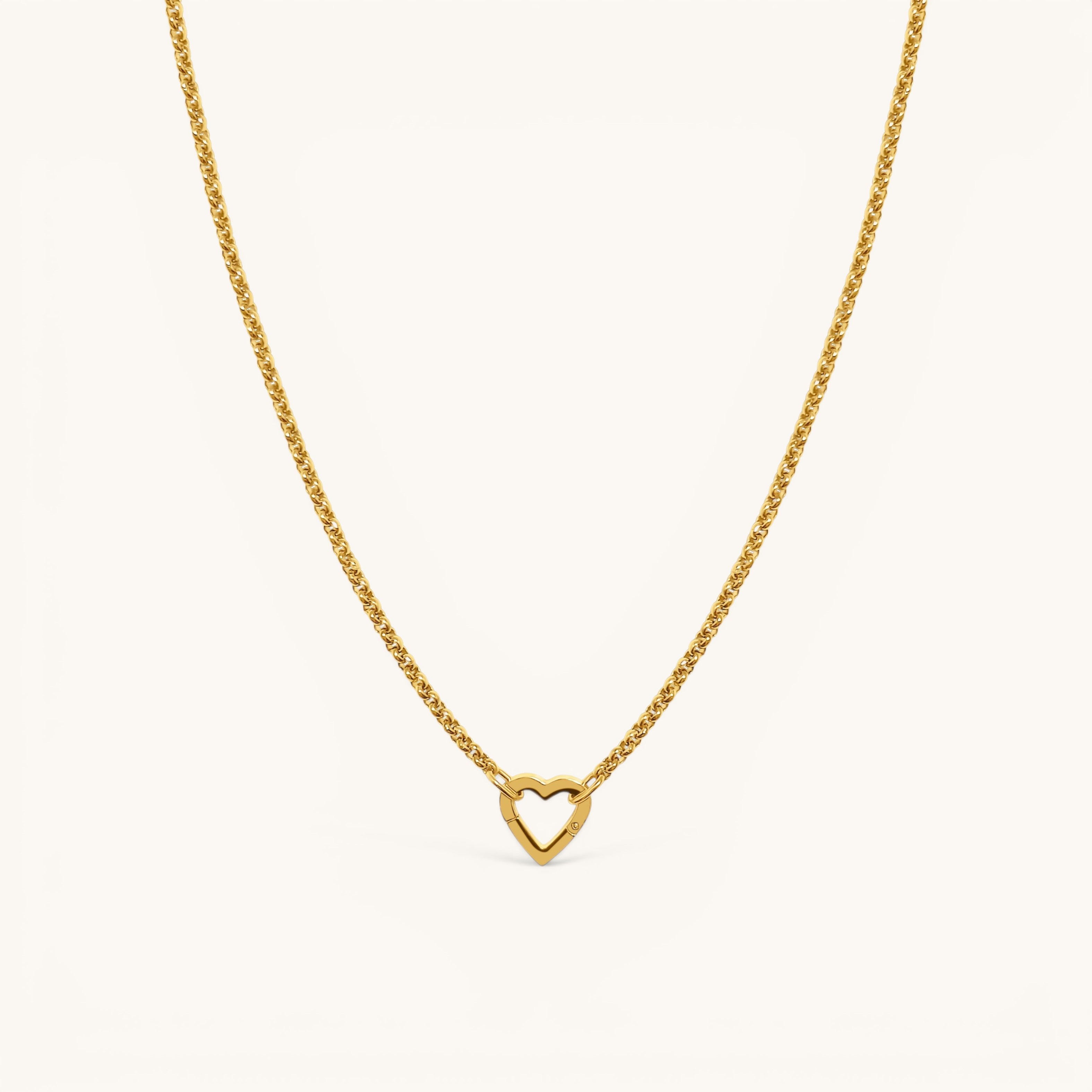 Nadare Co. gold plated Classic Switch Chain necklace with a heart-shaped pendant on a delicate link chain.