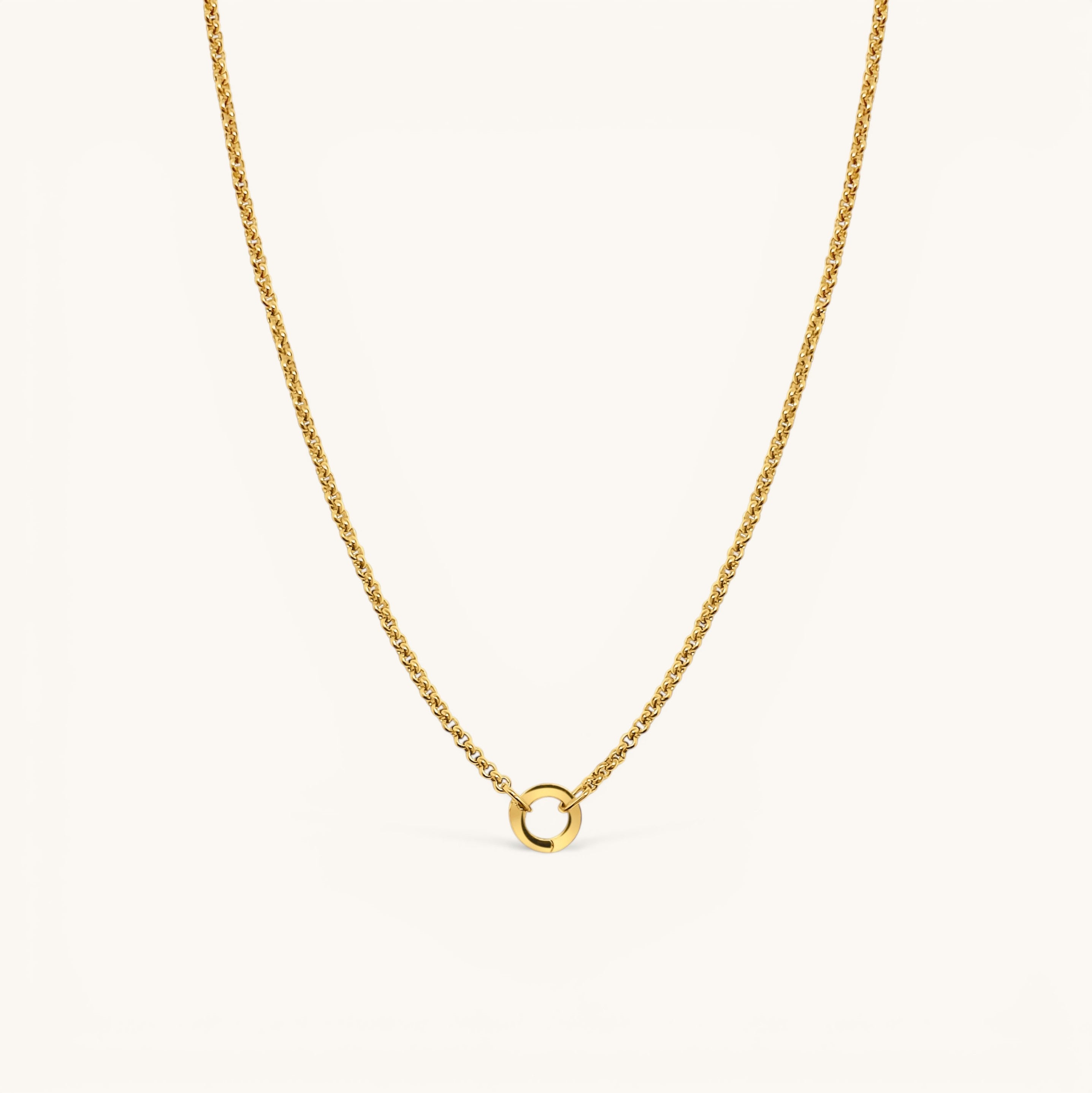 Nadare Co. gold plated stainless steel Classic Switch Chain necklace with a minimalist circular pendant.