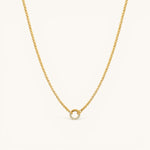 Nadare Co. gold plated Classic Switch Chain necklace with a dainty circular pendant featuring embedded crystals.