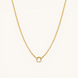 Nadare Co. gold plated Classic Switch Chain necklace with a dainty circular pendant featuring embedded crystals.