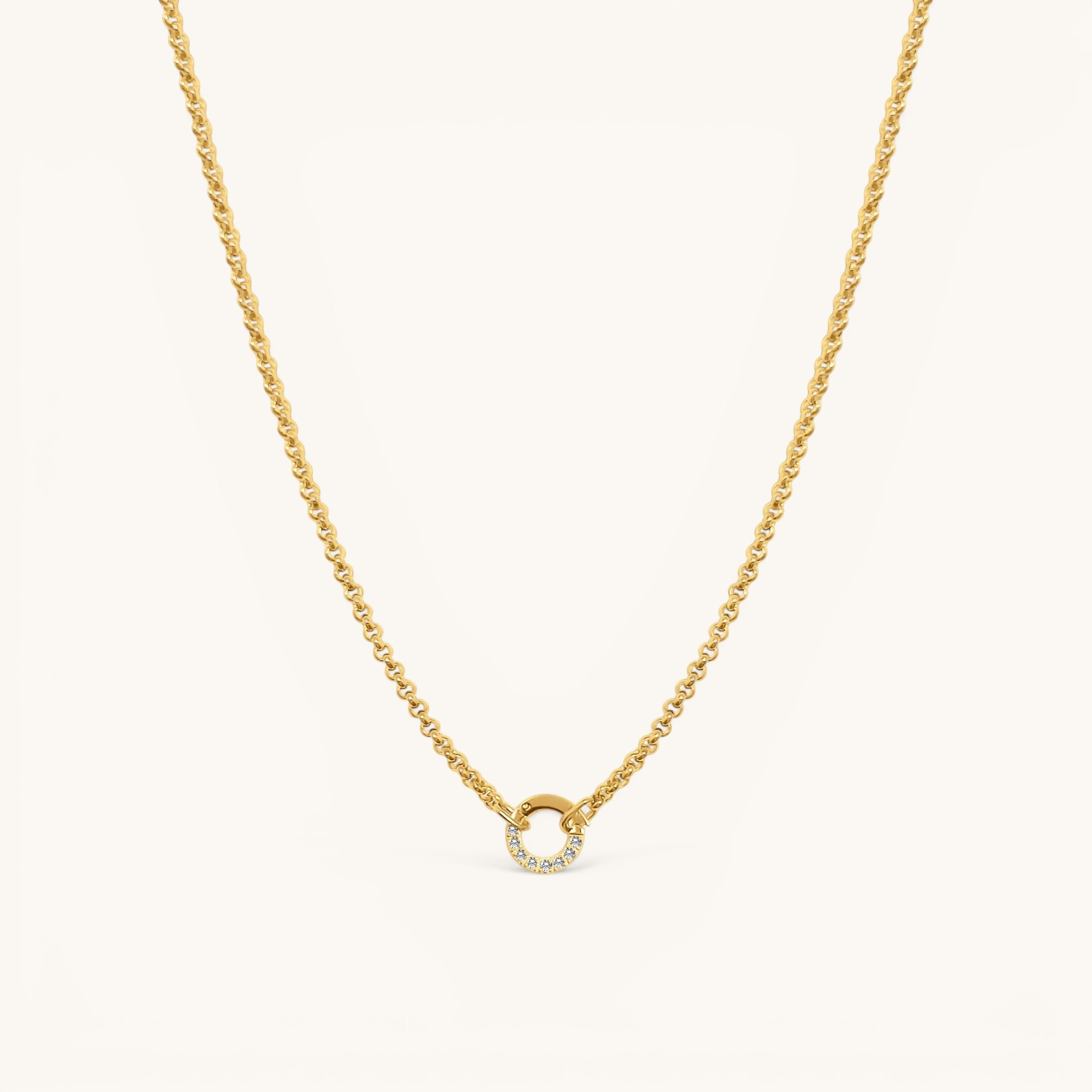 Nadare Co. gold-plated stainless steel Classic Switch Chain necklace with a crystal-accented circular pendant.