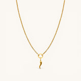 Nadare Co. Cornicello charm necklace featuring a delicate gold horn pendant on a fine cable chain.