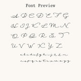 Elegant cursive font preview for custom Nadare Co. name necklaces, featuring uppercase and lowercase letters.