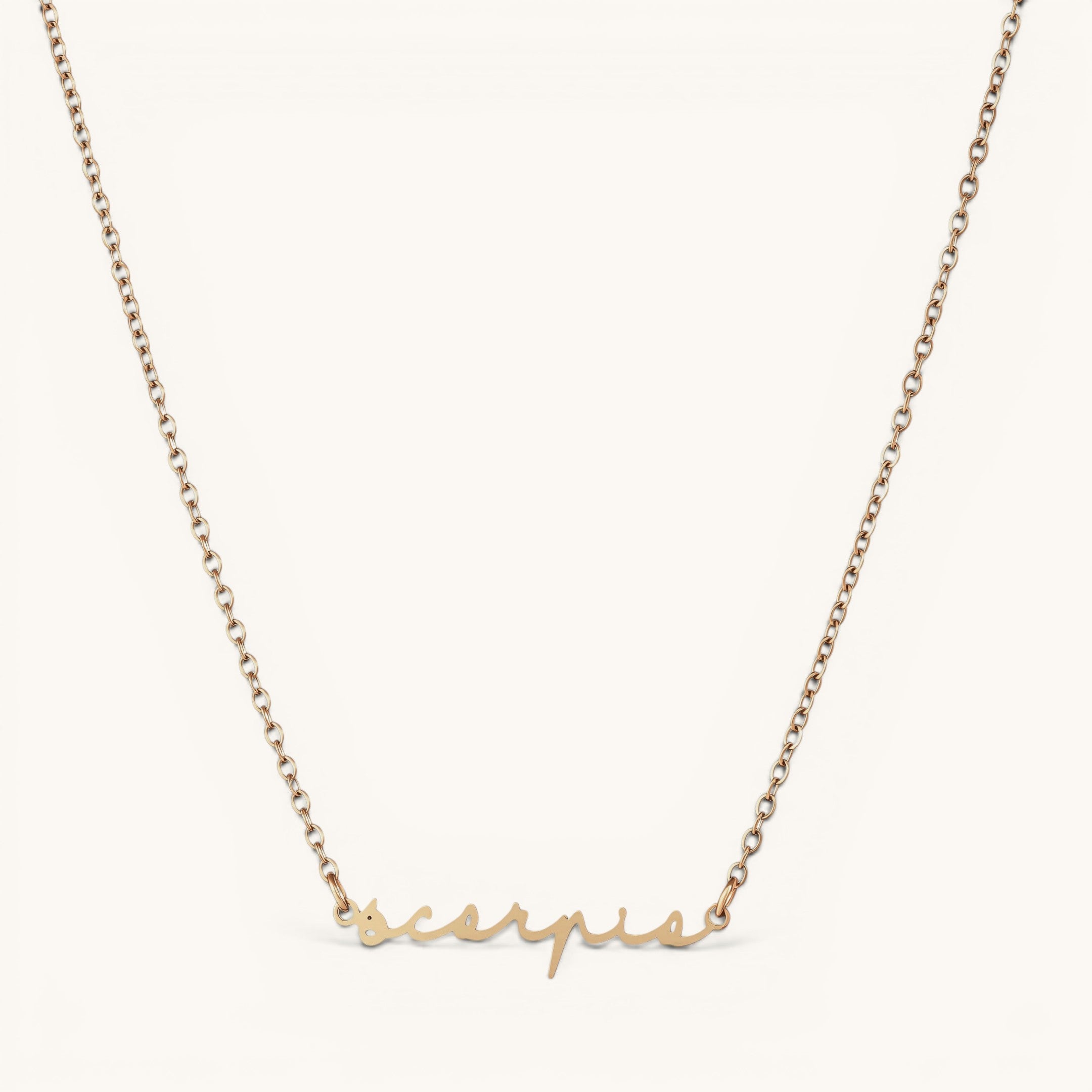 Nadare Co. gold plated stainless steel cursive name necklace featuring a Scorpio zodiac script pendant.