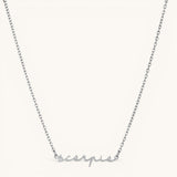 Nadare Co. silver stainless steel cursive name necklace featuring the word Scorpio in elegant script font.