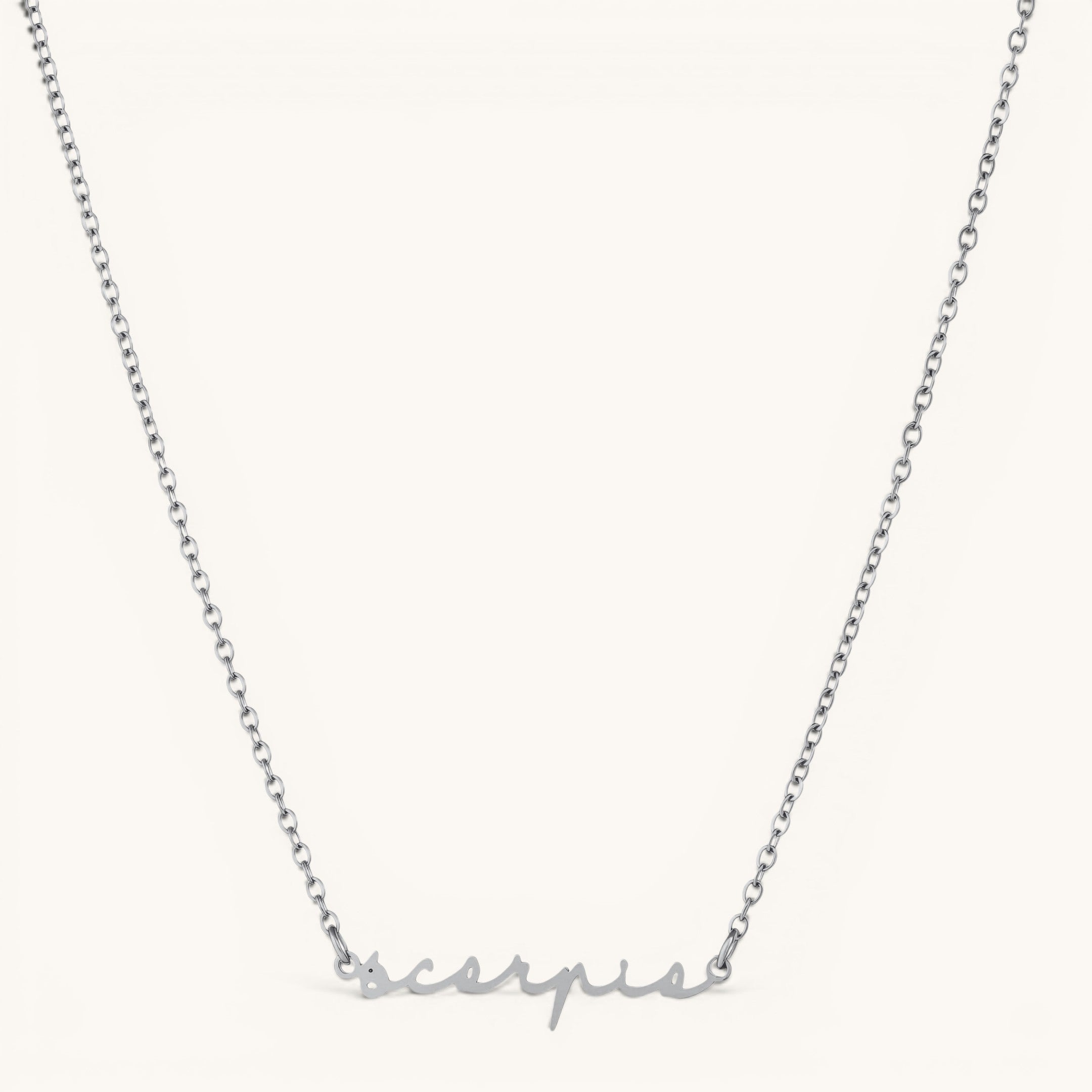Nadare Co. silver stainless steel cursive name necklace featuring the word Scorpio in elegant script font.