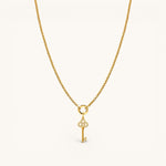Nadare Co. gold necklace featuring a delicate key charm pendant encrusted with sparkling diamonds.