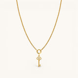 Nadare Co. gold necklace featuring a delicate key charm pendant encrusted with sparkling diamonds.