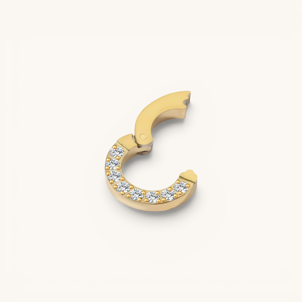 Nadare Co. Diamond Switch Clasp in 14k gold-plated stainless steel with sparkling cubic zirconia stones.