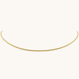 Nadare Co. Elena necklace featuring a delicate gold woven chain with a subtle shimmering texture.