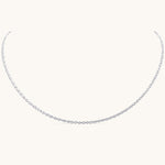 Nadare Co. Elena necklace featuring a delicate silver chain with an intricate woven texture for a subtle shimmer.