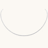 Nadare Co. Elena necklace featuring a delicate silver chain with an intricate woven texture for a subtle shimmer.