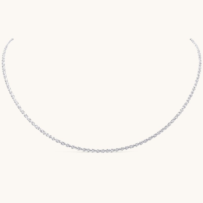 Nadare Co. Elena necklace featuring a delicate silver chain with an intricate woven texture for a subtle shimmer.