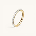 Nadare Co. Elodie Clicker Ring in gold-plated titanium with pavé-set cubic zirconia stones for piercings.