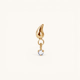 Nadare Co. Ember threadless piercing front in gold-plated titanium with a flame silhouette and cubic zirconia drop.