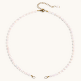 Nadare Co. freshwater pearl chain necklace with organic white pearls and gold-tone metal clasp and extender chain.