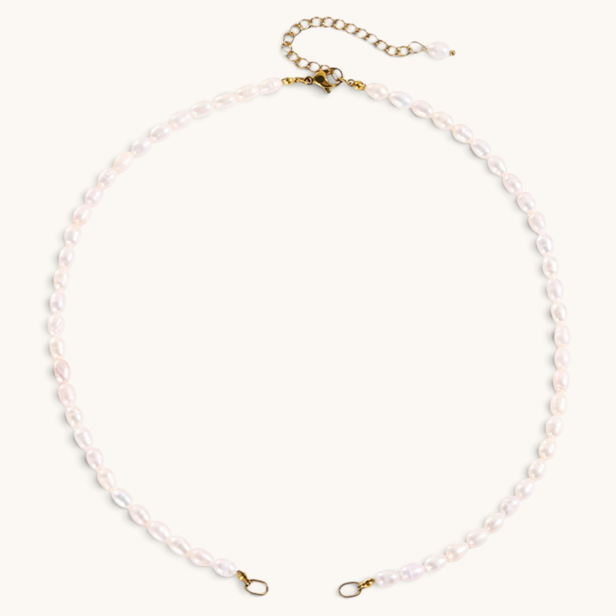Nadare Co. freshwater pearl chain necklace with organic white pearls and gold-tone metal clasp and extender chain.