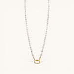 Nadare Co. freshwater pearl necklace featuring unique white pearls and a gold-toned oval clasp charm connector.