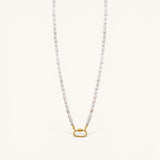 Nadare Co. freshwater pearl necklace featuring unique white pearls and a gold-toned oval clasp charm connector.