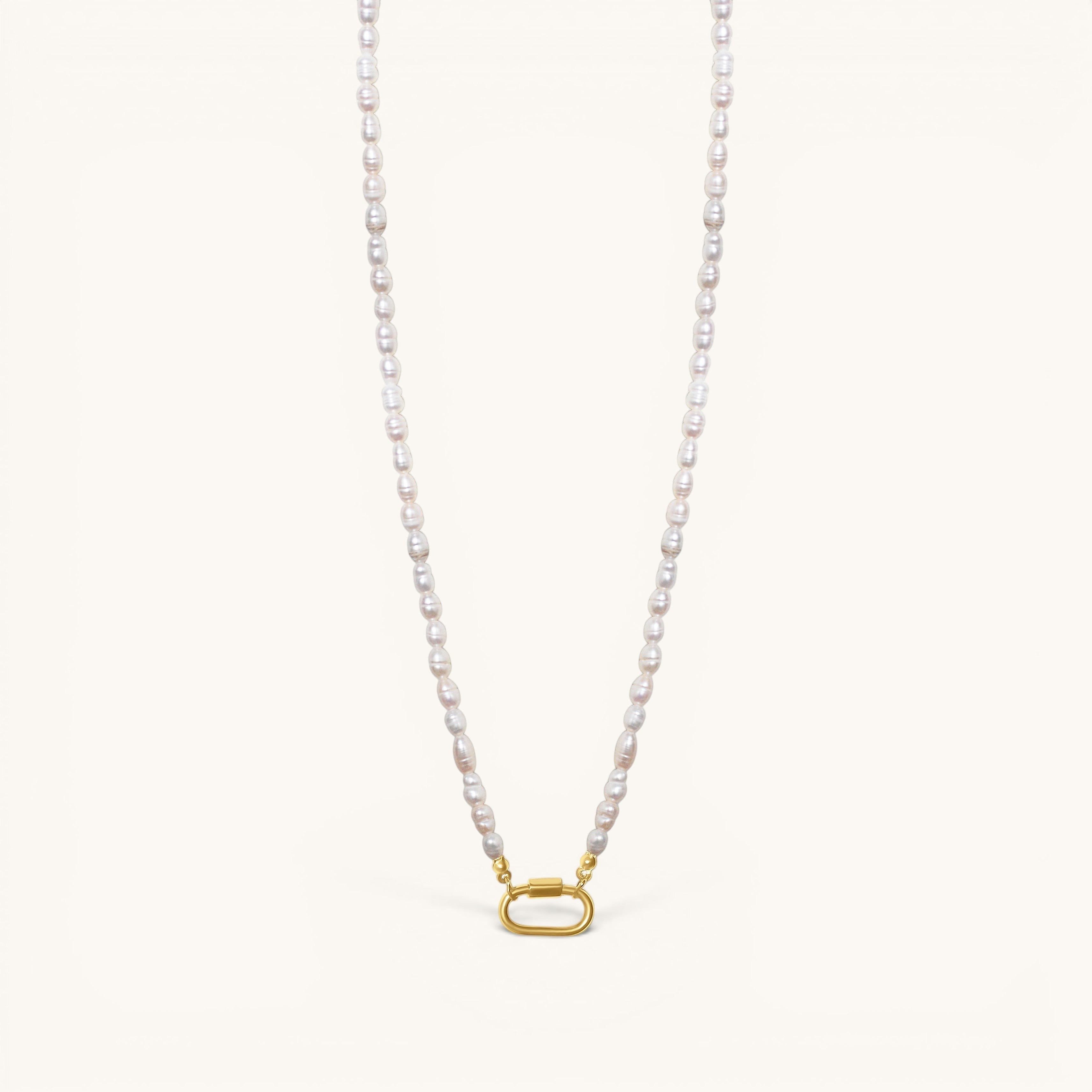 Nadare Co. freshwater pearl necklace featuring unique white pearls and a gold-toned oval clasp charm connector.