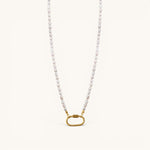 Nadare Co. freshwater pearl chain necklace with a gold-tone oval clasp charm connector on a cream background.