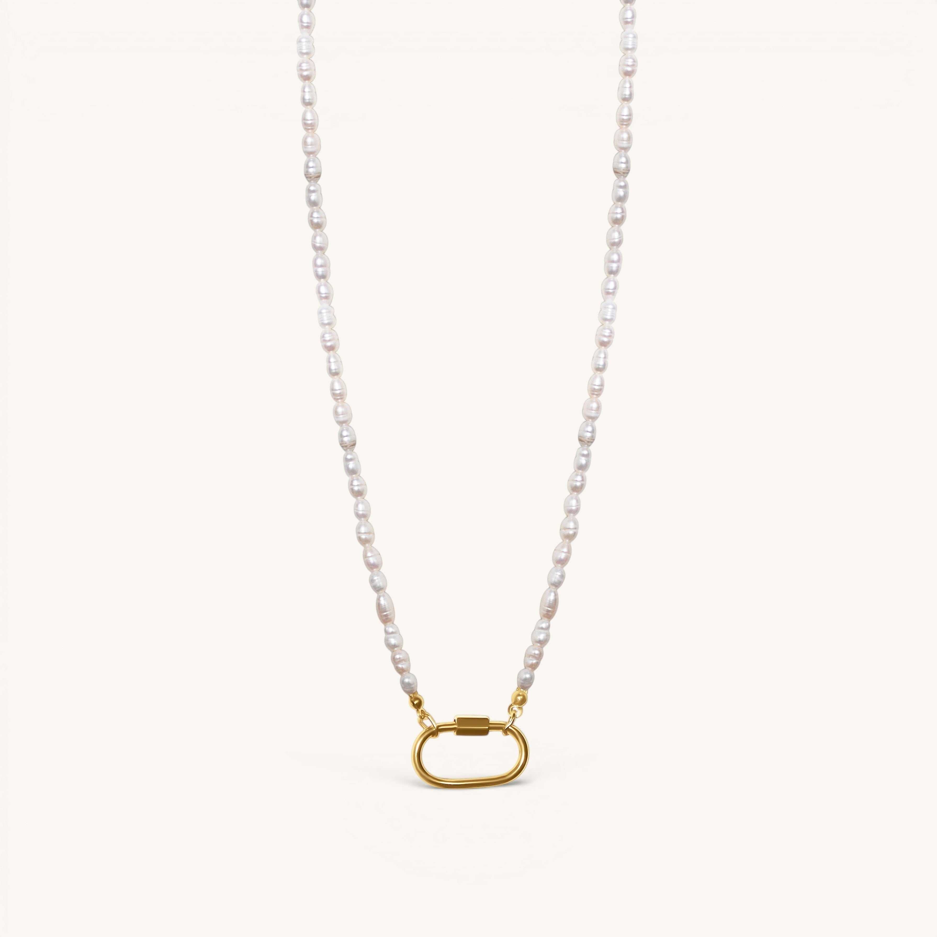 Nadare Co. freshwater pearl chain necklace with a gold-tone oval clasp charm connector on a cream background.