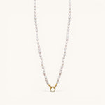 Nadare Co. freshwater pearl necklace with a gold-toned clasp featuring a circular crystal charm