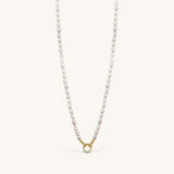 Nadare Co. freshwater pearl necklace with a gold-toned clasp featuring a circular crystal charm