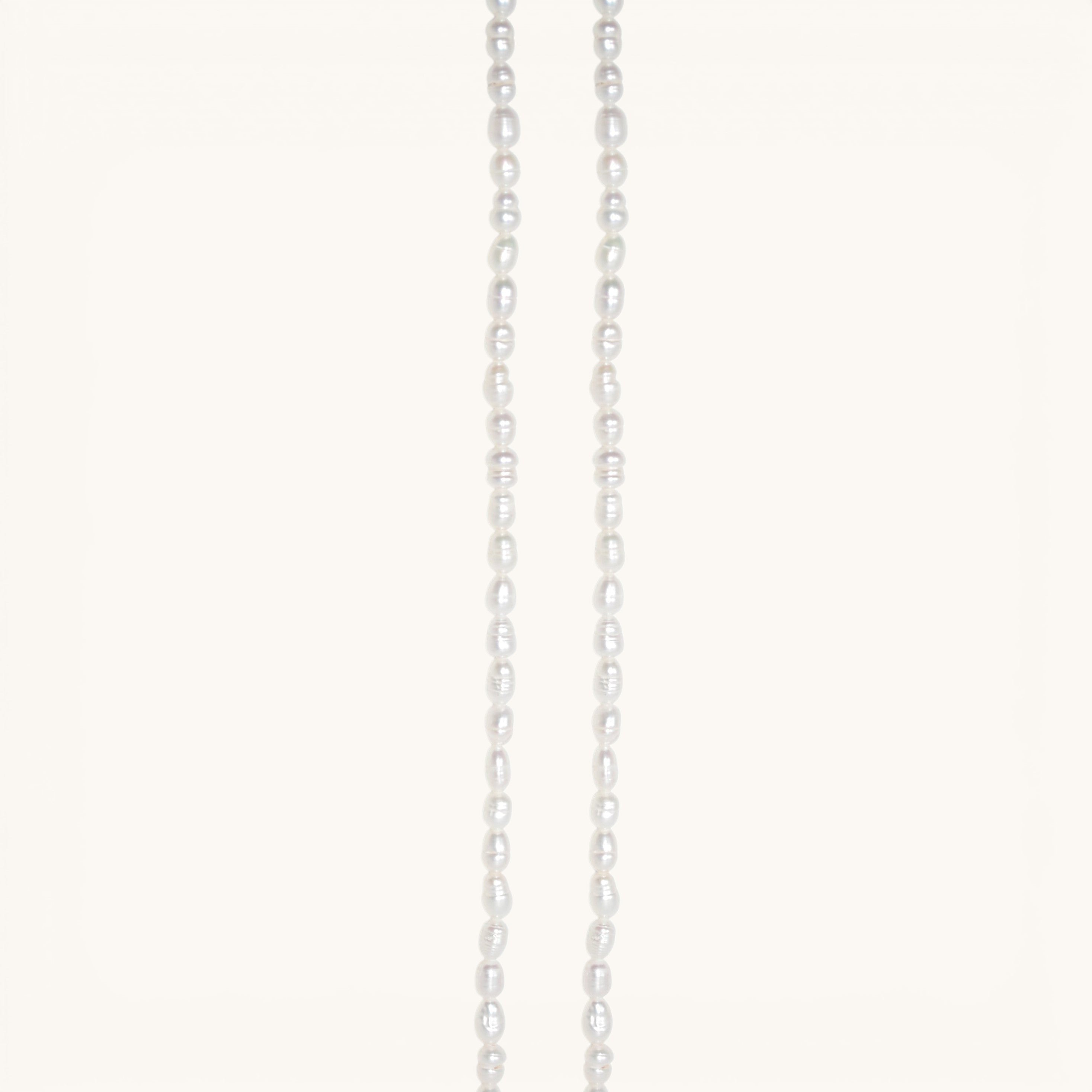 Nadare Co. freshwater pearl chain necklace featuring unique organic white pearls on a delicate strand