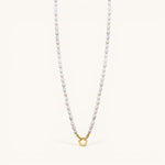 Nadare Co. freshwater pearl chain necklace with a gold-toned circular clasp on a light background.